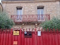 Outdoor swimming pool and relaxation area at Relais du Micocoulier in Vendargues