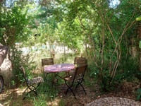 View of the shaded terrace and the garden